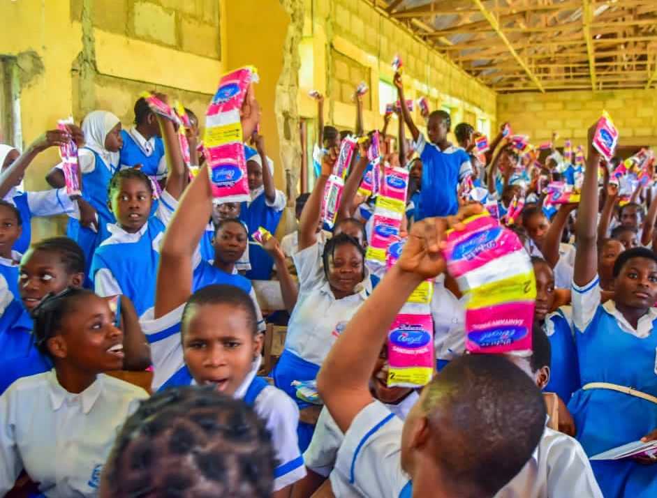 Girls celebrating receiving sanitary pads
